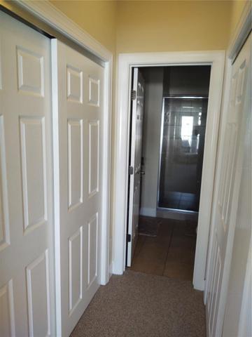 Primary hall past closets to bath