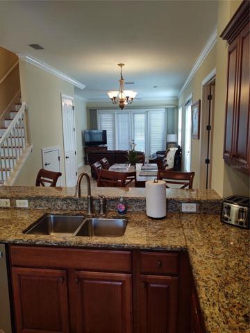 open view kitchen through dining room to living room