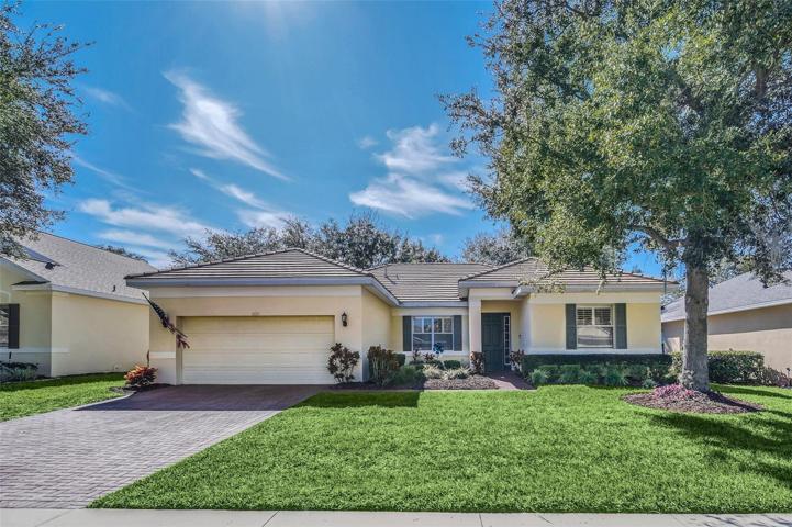 FRONT VIEW OF PROPERTY, BEAUTIFUL LANDSCAPING.