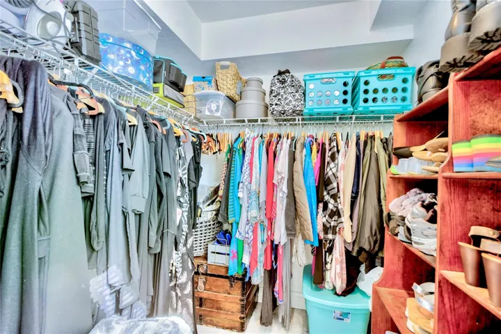 Walk in Closet with adjacent stackable washer & Dryer for convenience.