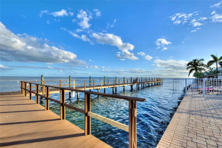 Private pier with adjacent pool / spa and clubhouse