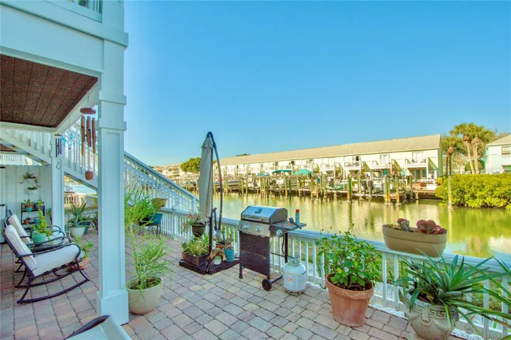 Private waterfront patio offers shaded and non- shaded outdoor living space.
