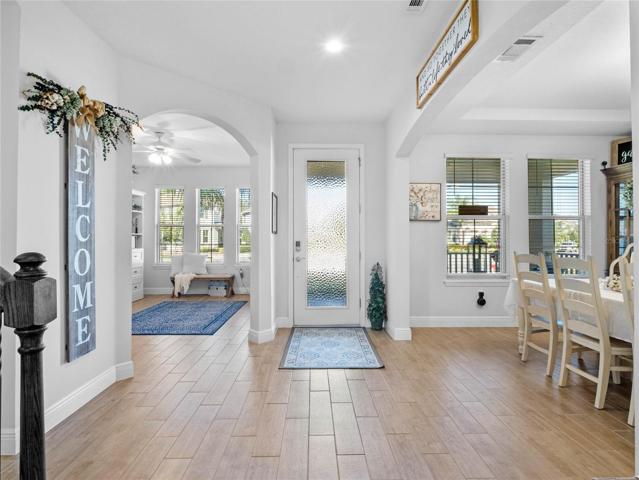 LIGHT and BRIGHT Entry!  First Floor is all WOOD PLANK PORCELAIN TILE FLOORING!