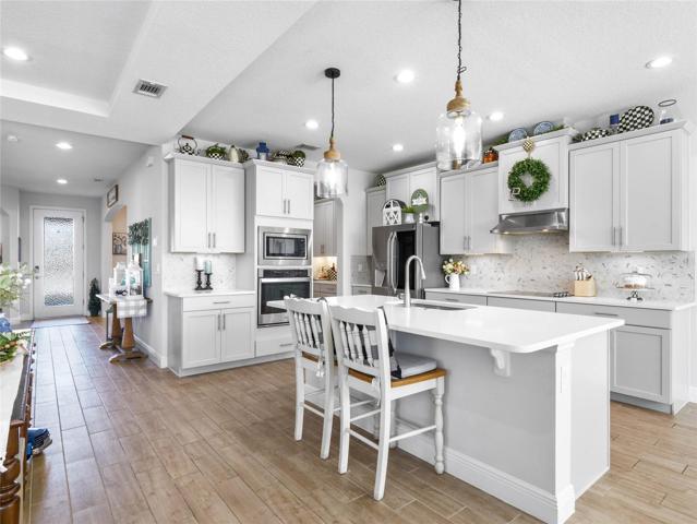 Stunning Kitchen with Shaker Cabinets, Carerra Backsplash and QUARTZ Counters!