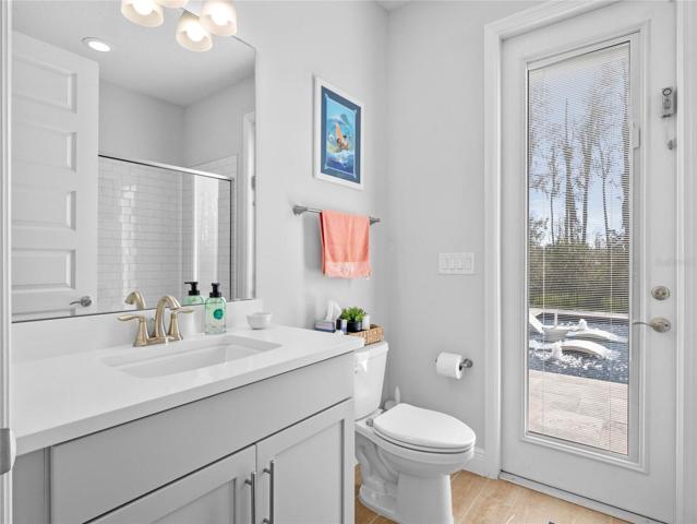 Convenient POOL BATH is full bath #4 with Shower, Upgraded Tile, Shampoo Niche and Shower Enclosure
