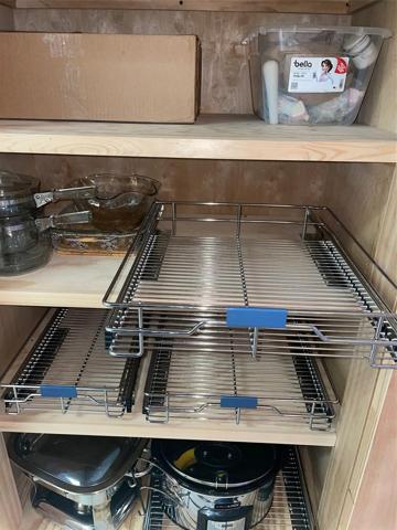 Custom cabinetry in FL Room features pull outs.