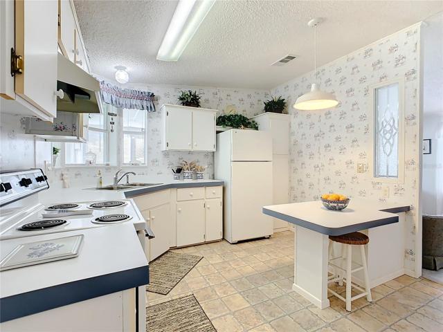 The kitchen has a breakfast bar