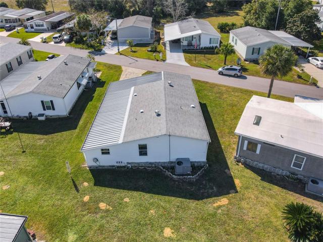Aerial of the home and backyard