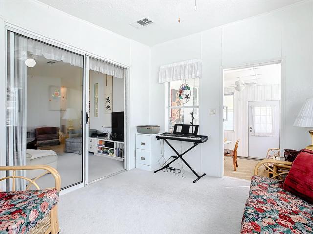 The bonus room has sliding doors opening to the living room