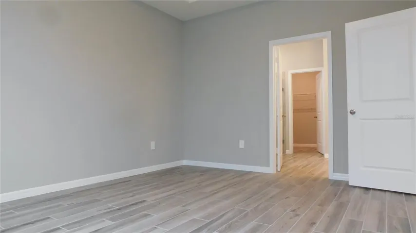 The Primary Bedroom is spacious and features a tray ceiling, ensuite bath and HUGE walk in closet