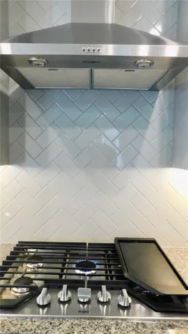 Gourmet gas cooktop with stainless hood