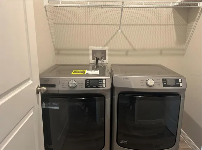 High end washer and dryer in the well equipped laundry room