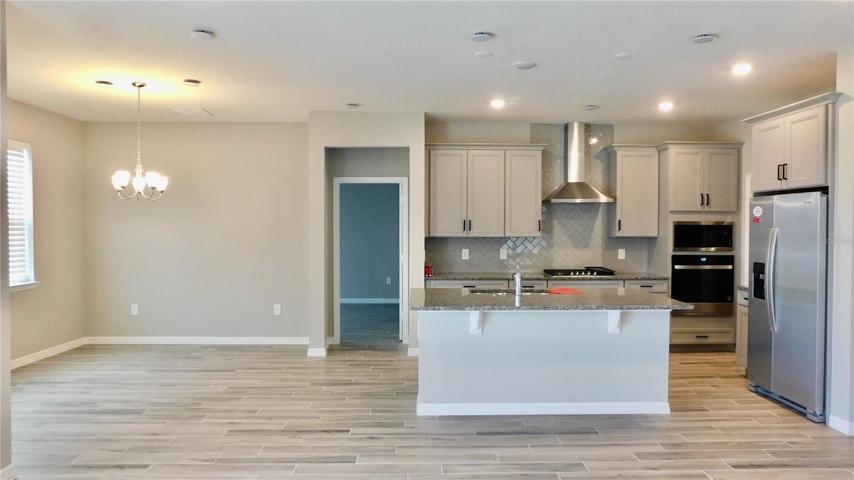 Stainless appliances, eat around island, spacious dining room and all open to family room!