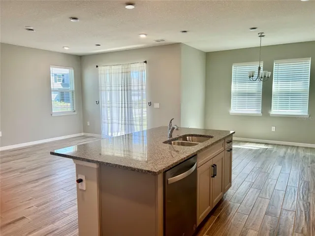 Spacious and open floorplan with sliding doors to expansive fenced yard