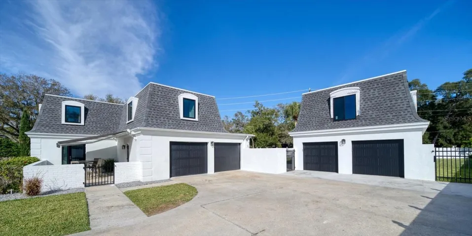Detached garage to right has partially finished loft apartment