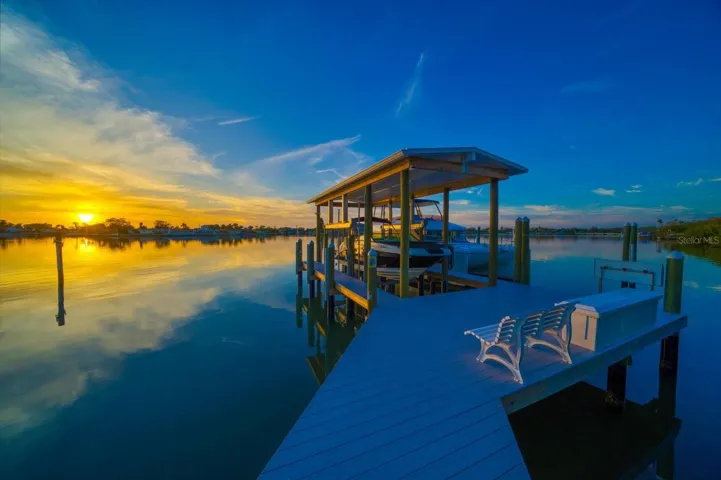 Rare covered dock with lift and large slip