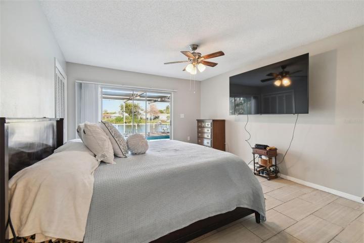 Primary bedroom overlooking lake with ensuite bathroom