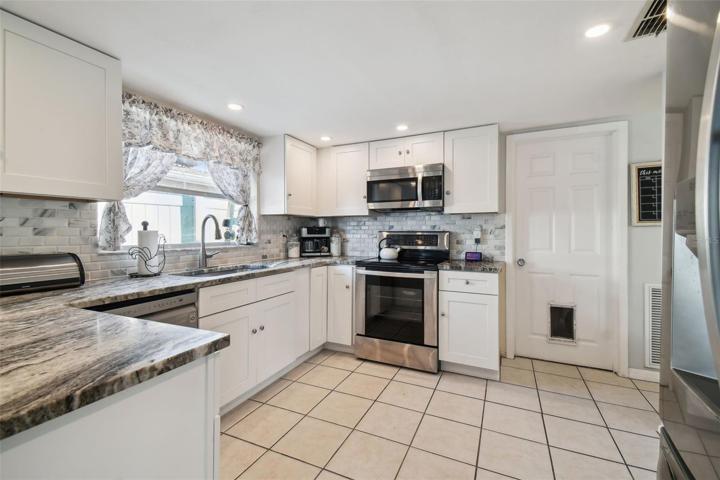 Granite countertops, stainless appliances and closet pantry