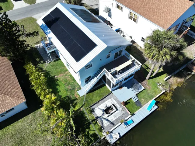 Firepit, fenced yard, patio, balcony, dock and screen room to enjoy the water