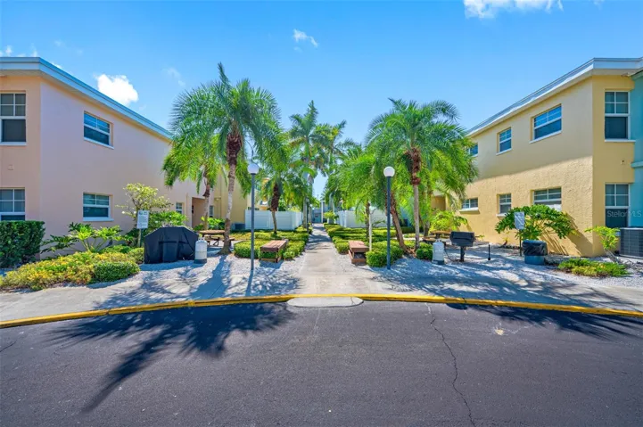 Various grilling and outdoor dining areas with winding sidewalks throughout Barefoot Beach