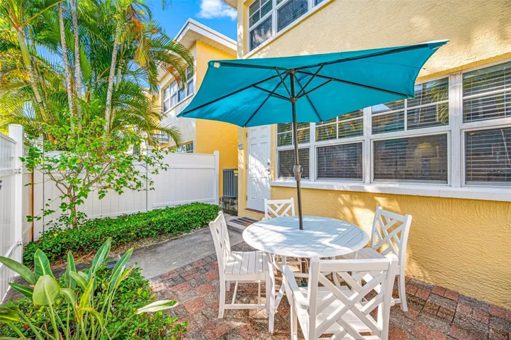 Table & Chairs with Umbrella and outdoor lighting