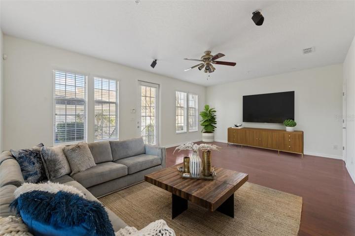 Virtually staged...21x14 Family room with windows looking out into the patio/courtyard