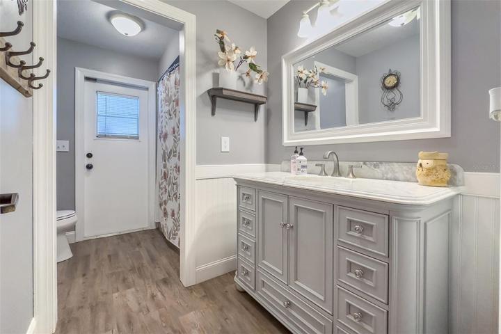 25. Renovated Hall Bath with door to pool