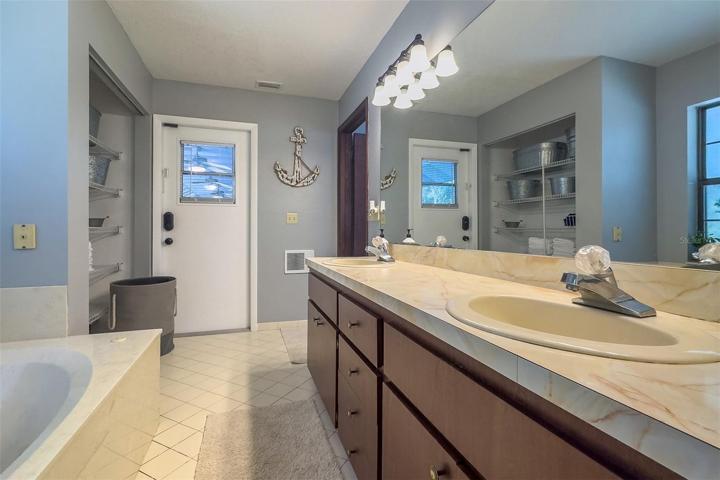 32. Primary Bath with door to pool
