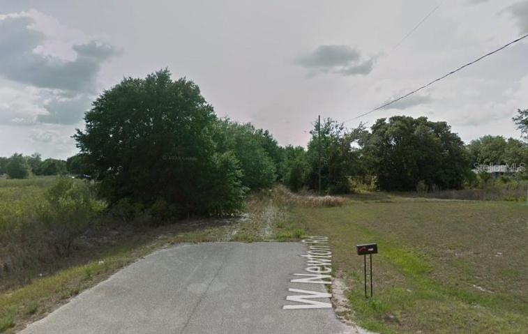 Paved road ends - property is beyond this on the right.