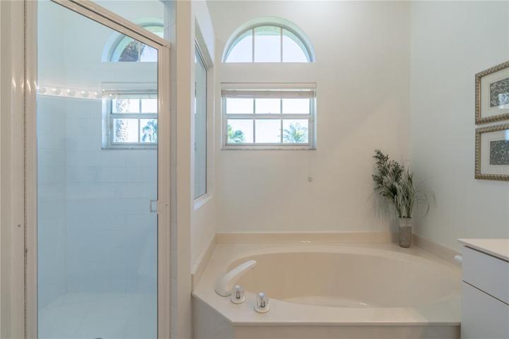 Primary bathroom walk in shower and bathtub