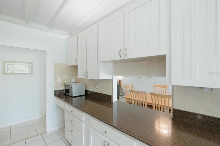 Kitchen pass through to dining area.
