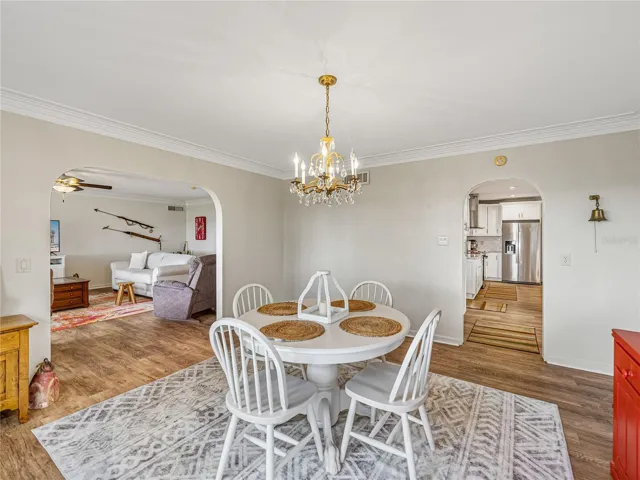 This angle shows the archway into the kitchen off the dining room.
