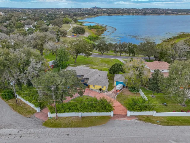 Very private back yard with concrete wall and two gates.