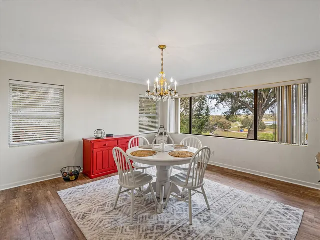 Dining room view showing the picture window and crown molding.