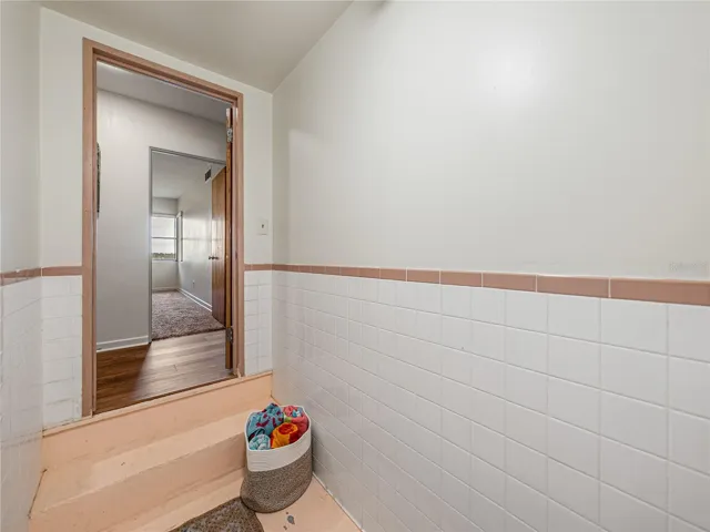This shows the steps leading down into the changing area from the hallway in the house.