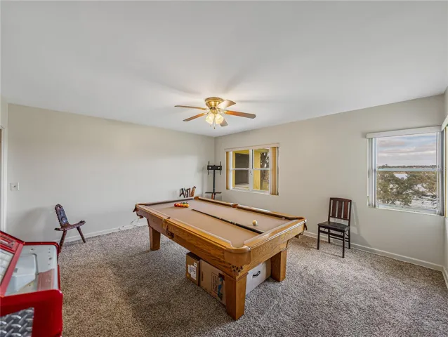 This is the 3rd bedroom located on the front of the home.  Lake views from this room too.  Currently being used as a game room.
