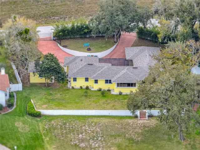 Aerial view of the property. Half circle drive can be seen--electronic gates are at each end.  Welcome to this beautiful home!!!!