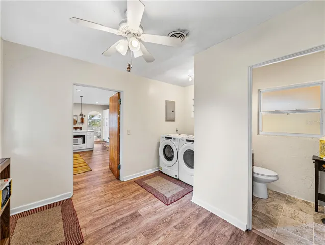 Inside laundry room view from the other end looking into the kitchen.