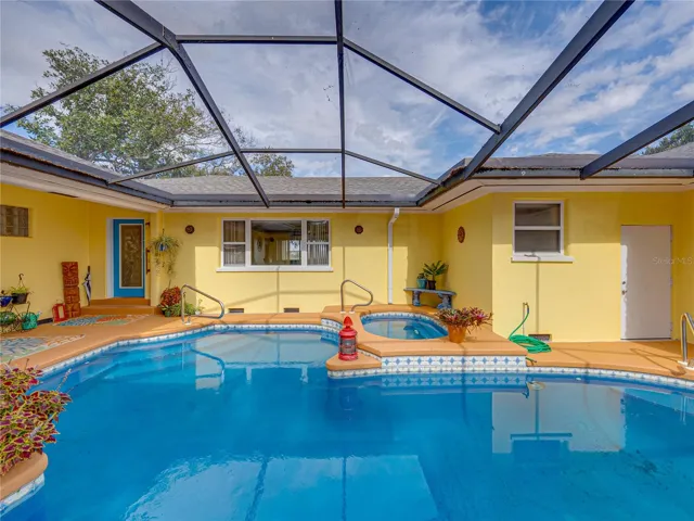This view shows the rear door into the property.  The white door to the right is the 