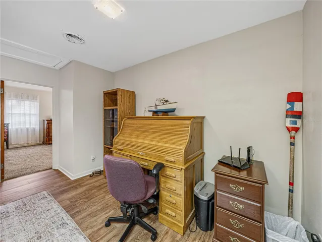 Area at end of hall between bedroom 1 and bedroom 2.  Currently being used as office space.