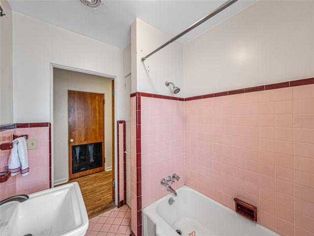 This is the view looking into the hallway.  There is also a linen closet in this bathroom by the door.