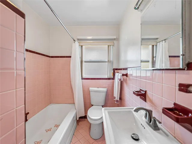 This bathroom has a tub and shower.