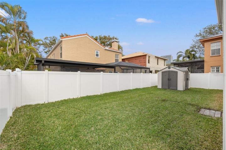 Fenced-in Backyard with Outdoor Multi-purpose Shed
