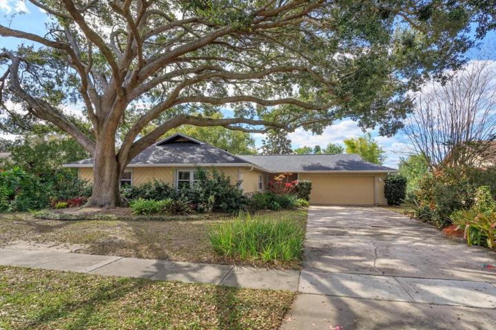 Inviting entrance with expansive driveway and oversized 2 car garage.