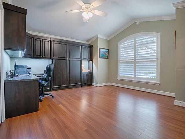 SPACIOUS FRONT GUEST ROOM WITH VAULTED CEILINGS AND LOVELY LAMINATE FLOORING, BUILT-IN DOUBLE MURPHY BED, DESK AND LOTS OF CABINET SPACE.