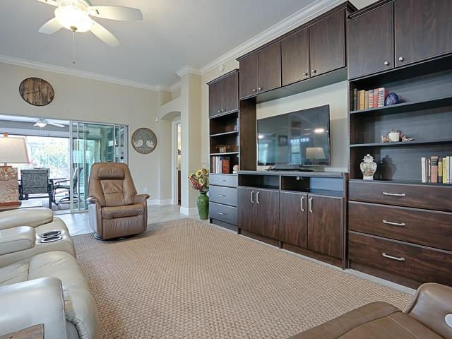 SLIDING GLASS DOORS OPEN OUT TO THE GLASS ENCLOSED LANAI.