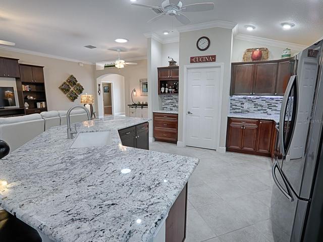 WINE/COFFEE BAR TO THE LEFT OF THE DOOR.  THIS DOOR LEADS TO THE LAUNDRY ROOM AND GARAGE.