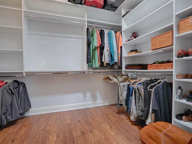 LARGE WALK-IN CLOSET WITH BUILT-INS - SO MUCH EXTRA STORAGE SPACE.