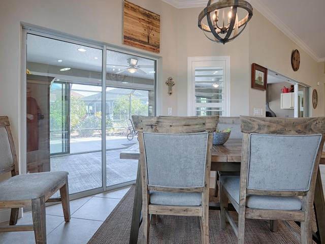 SLIDING GLASS DOORS OUT TO THE ENCLOSED LANAI FROM THIS AREA TOO.