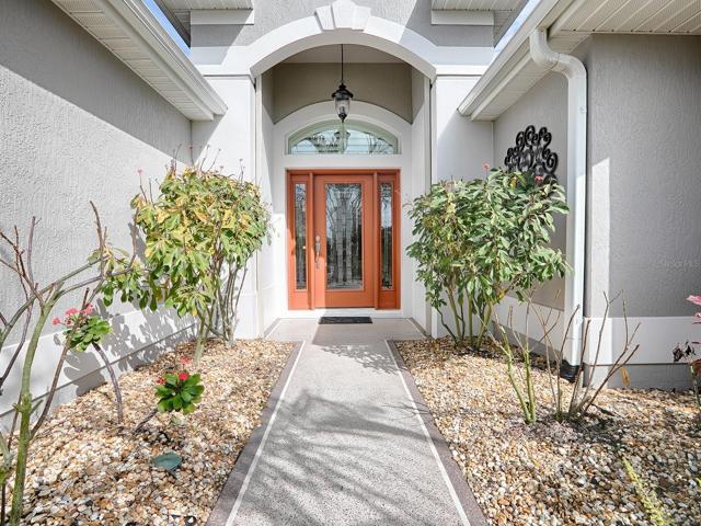 PAINTED DRIVE AND WALKWAY OFFER NICE CURB APPEAL AS WELL AS AN INVITING ENTRANCE.  LOVELY LEADED GLASS FRNT DOOR AND SIDELITES.